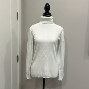 WHBM White knit turtleneck with zipper accents on sleeves.